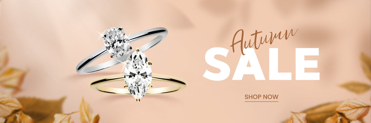 Syksyaiheinen banneri jossa kaksi timanttisormusta tekstit Autumn SALE ja SHOP NOW sekä syksyn lehtiä