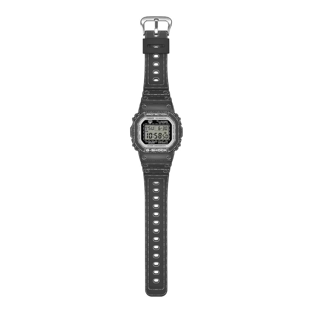 Casio G-Shock DW-5600RGM-1ER rannekello mustalla rannekkeella ja taululla