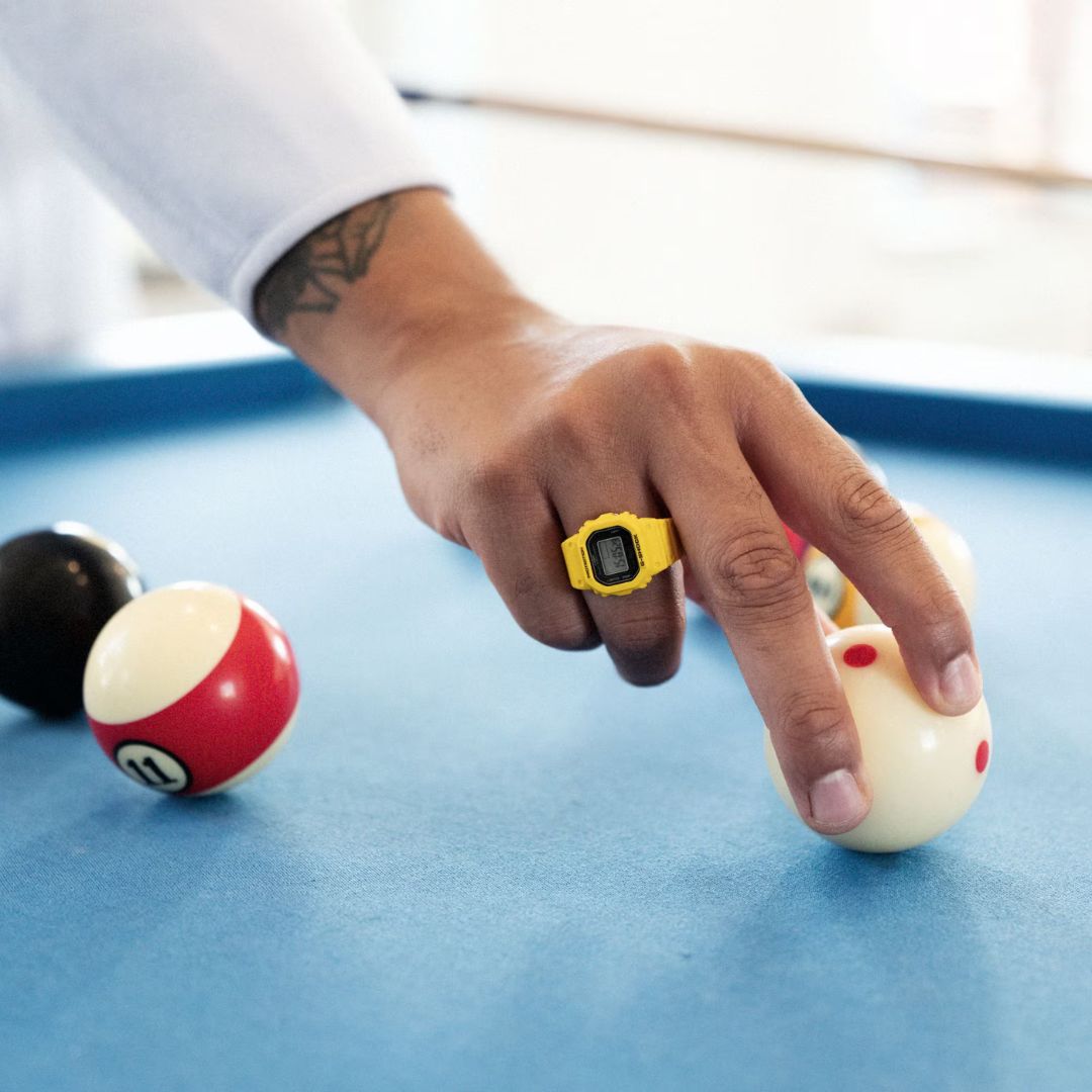 Casio G-Shock Nano DWN-5600-9ER sormuskello keltaisella rannekkeella