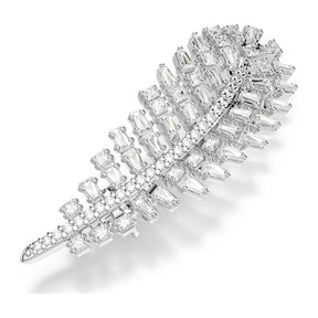 Swarovski sulanmuotoinen rintakoru vaaleaksi rodinoitua metallia ja säihkyviä kirkkaita zirkoneita.