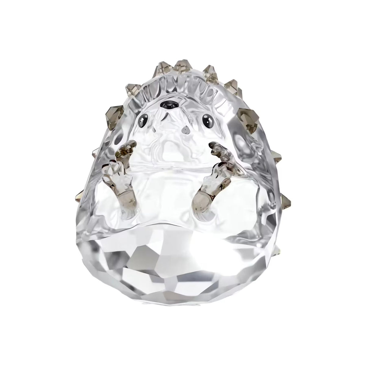 Swarovski kristallinen siilifiguuri, jossa on piikikäs pinta, suloiset kasvonpiirteet ja valoa heijastavat hionnat.