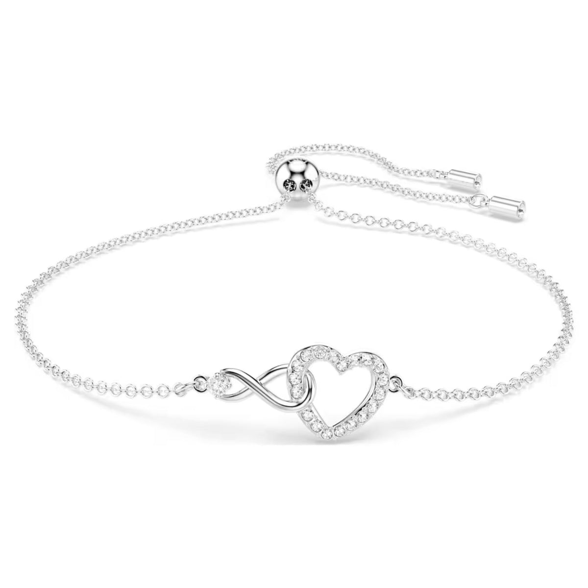 Swarovski valkoinen rannekoru ikuisuussymbolilla ja kirkkailla kristalleilla koristellulla sydämellä